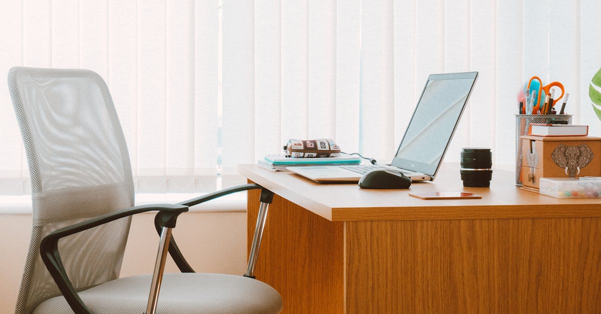 A tranquil modern home office featuring a wooden desk, ergonomic chair, and soft natural light.