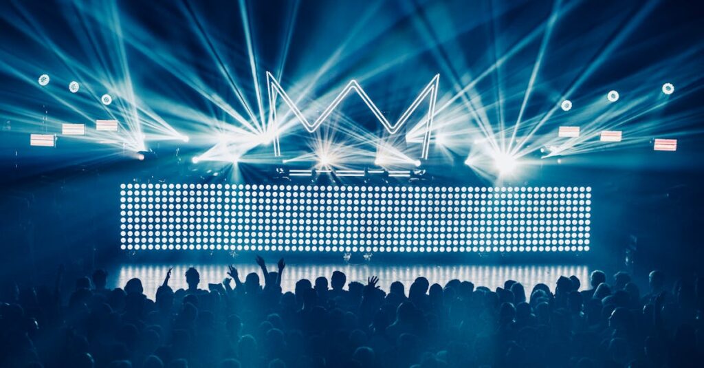 An electrifying concert atmosphere featuring dynamic laser lights and a vibrant crowd enjoying live music.