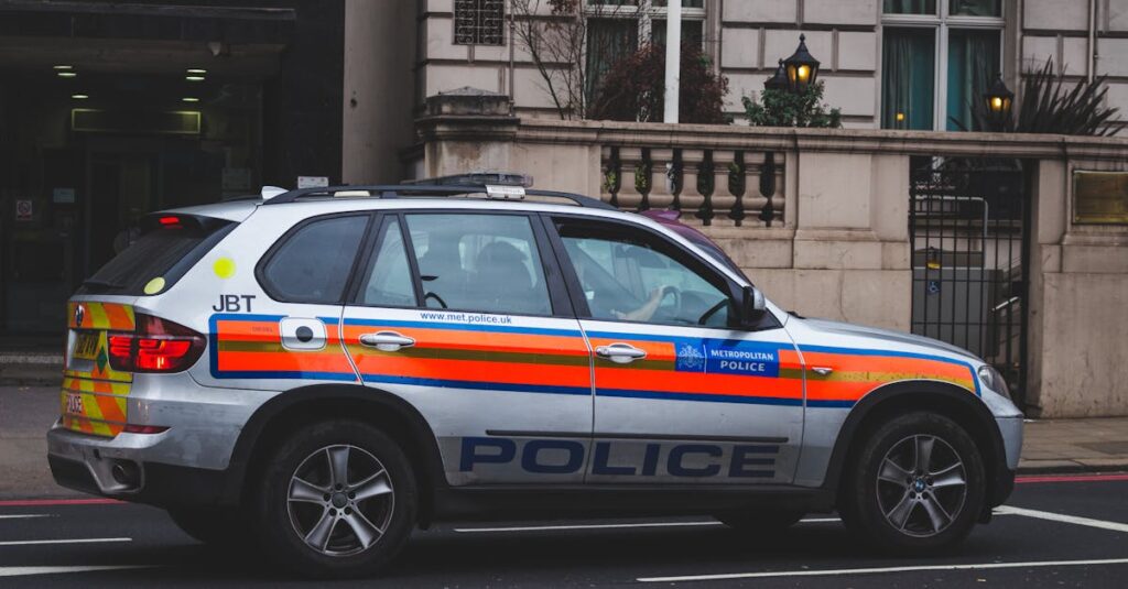 Police vehicle parked on an urban street outside a London building