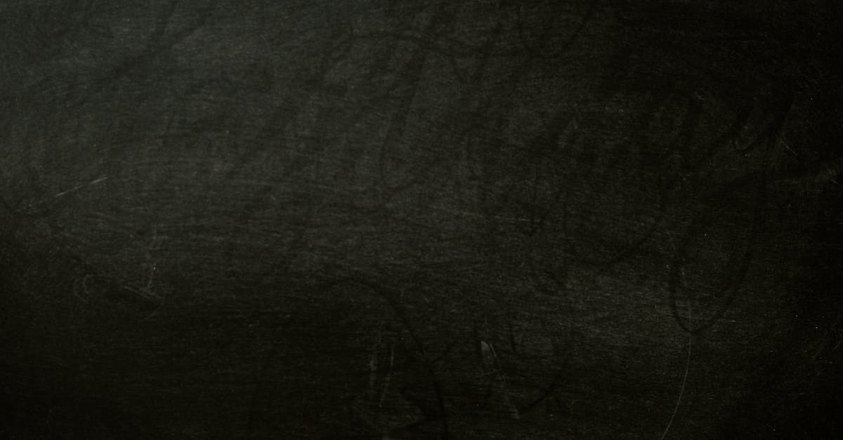 A textured dark chalkboard background, perfect for design projects.
