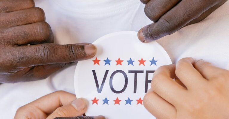 A diverse group advocating democracy with a vote sticker.