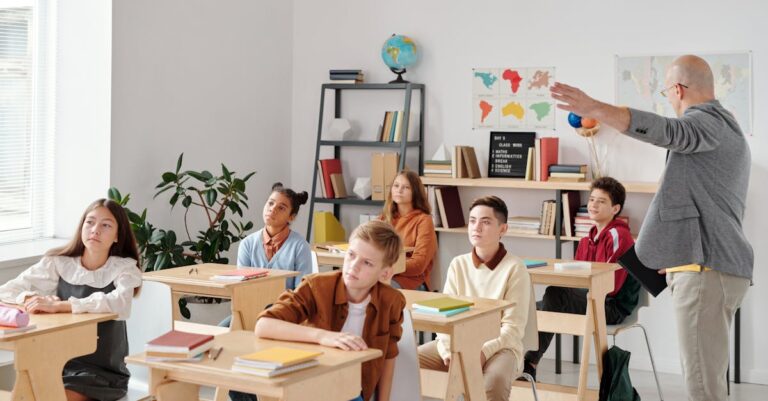 A diverse group of students attentively participating in a classroom lesson led by a teacher.