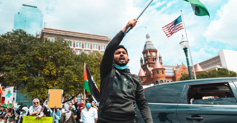 A passionate demonstration featuring Palestinian flags and diverse participants, capturing the spirit of activism.