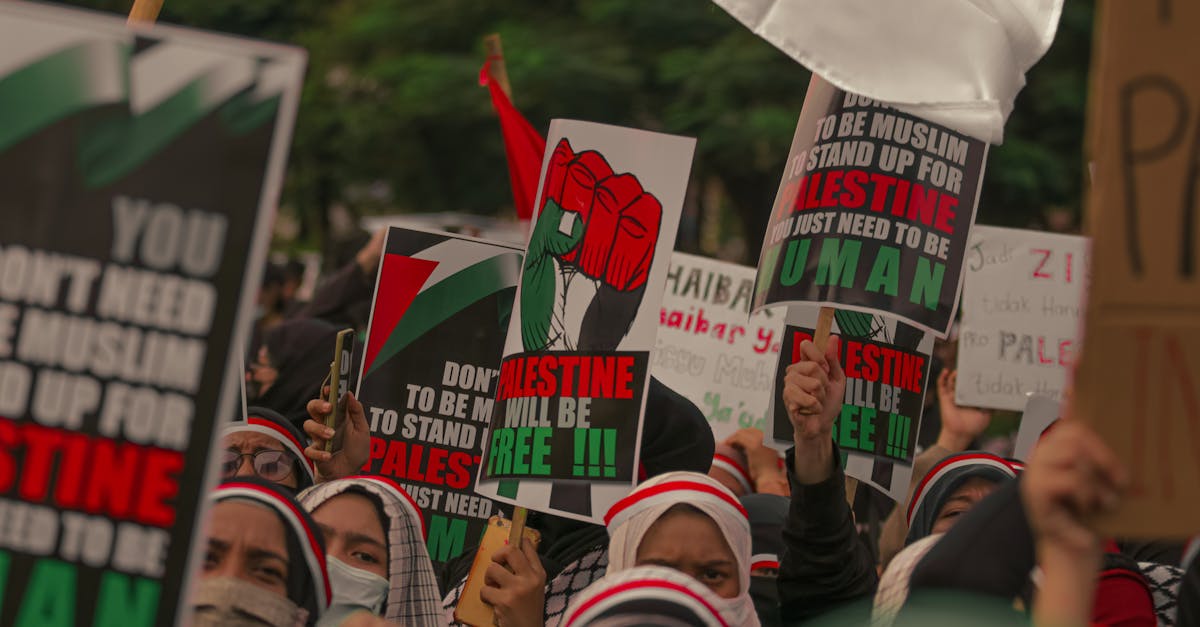 Demonstrators in Jakarta rally for Palestine with impactful signs and expressions of solidarity.