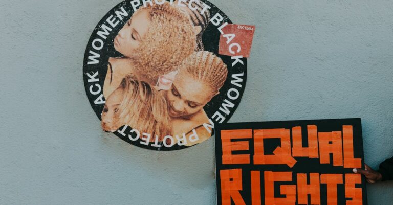 A mural advocating for black women's rights alongside a bold 'Equal Rights' sign.