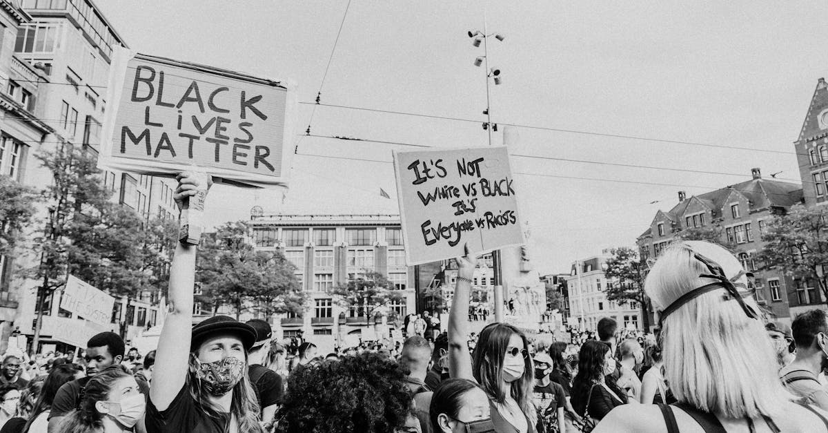 Protesters rally in Amsterdam with signs supporting the Black Lives Matter movement.