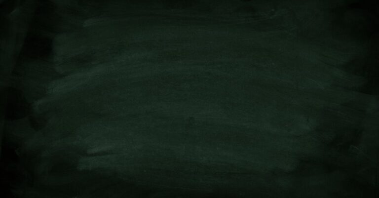Dark green chalkboard with subtle chalk marks for background use.