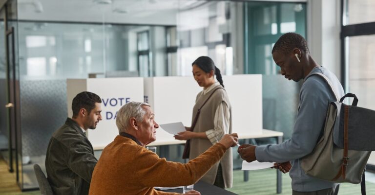 People of various backgrounds participating in voting at a polling station.