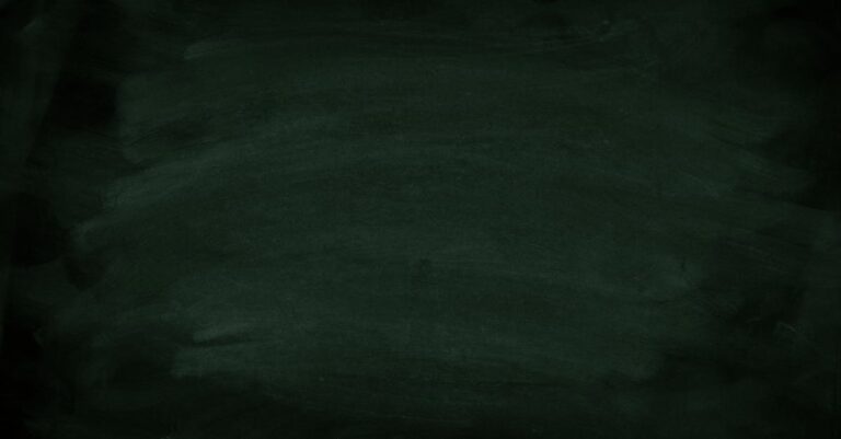 Dark green chalkboard with subtle chalk marks for background use.